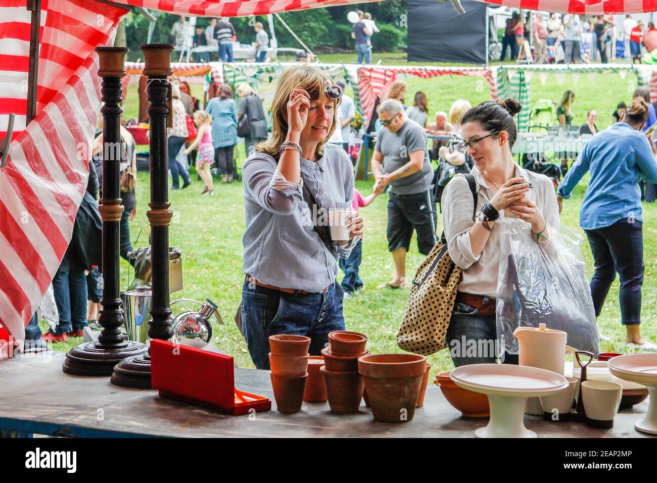 Ladies browsing the market stalls at Underground Festival in Crystal Palace,South London Stock Photo