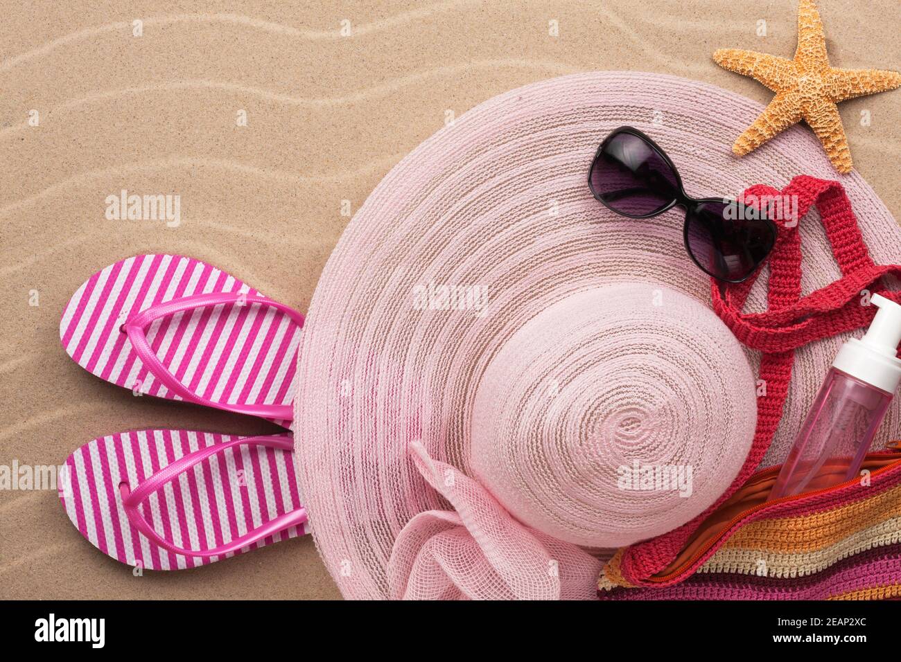 Accessories for the beach lying on the sand Stock Photo