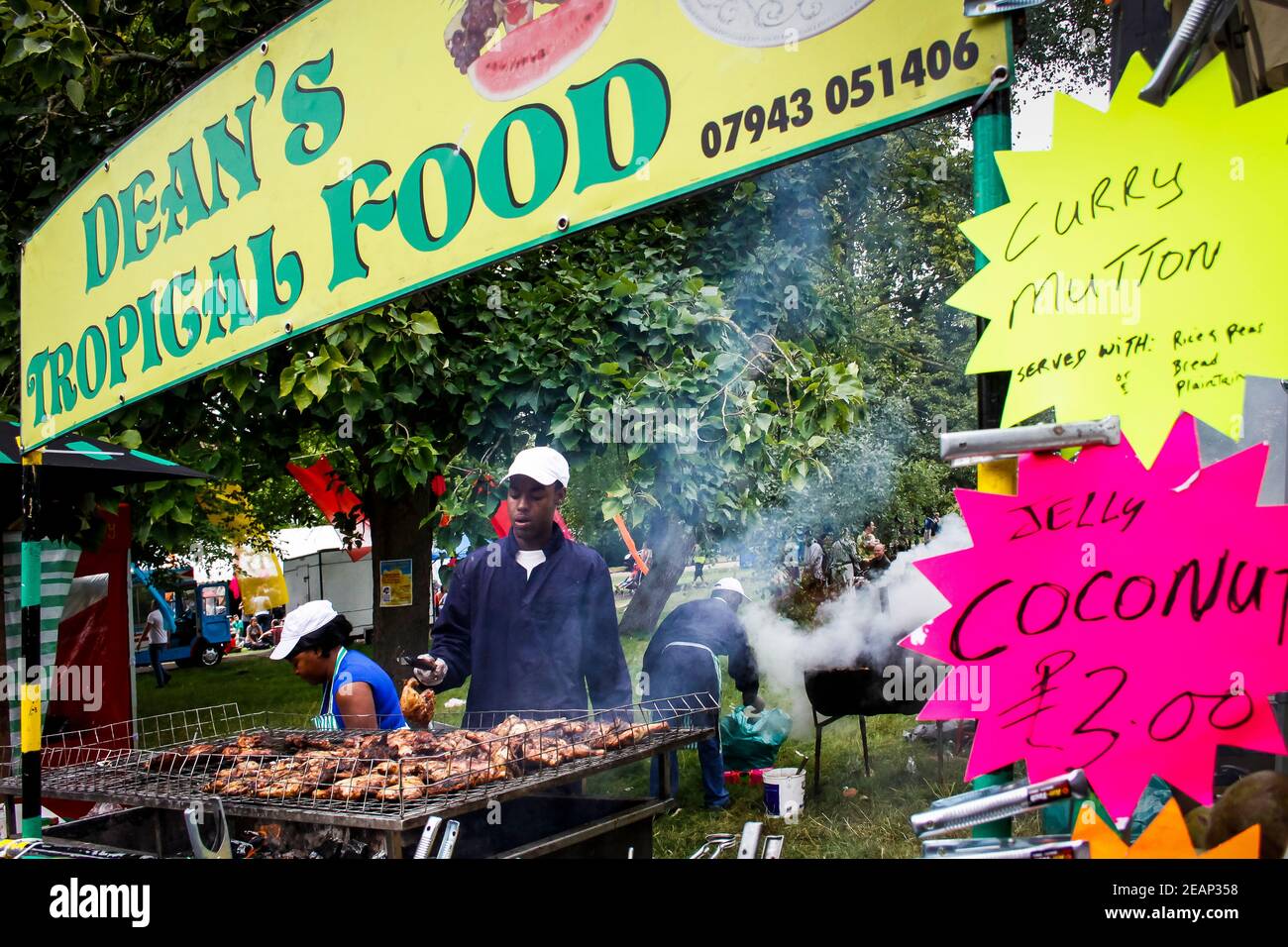 Jerk chicken at Jamaican food stall at Underground Festival in Crystal Palace,South London Stock Photo