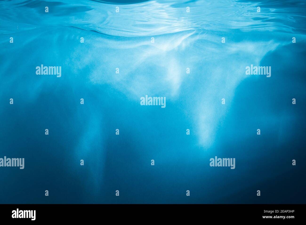 Abstract blue background. Water with sunbeams Stock Photo