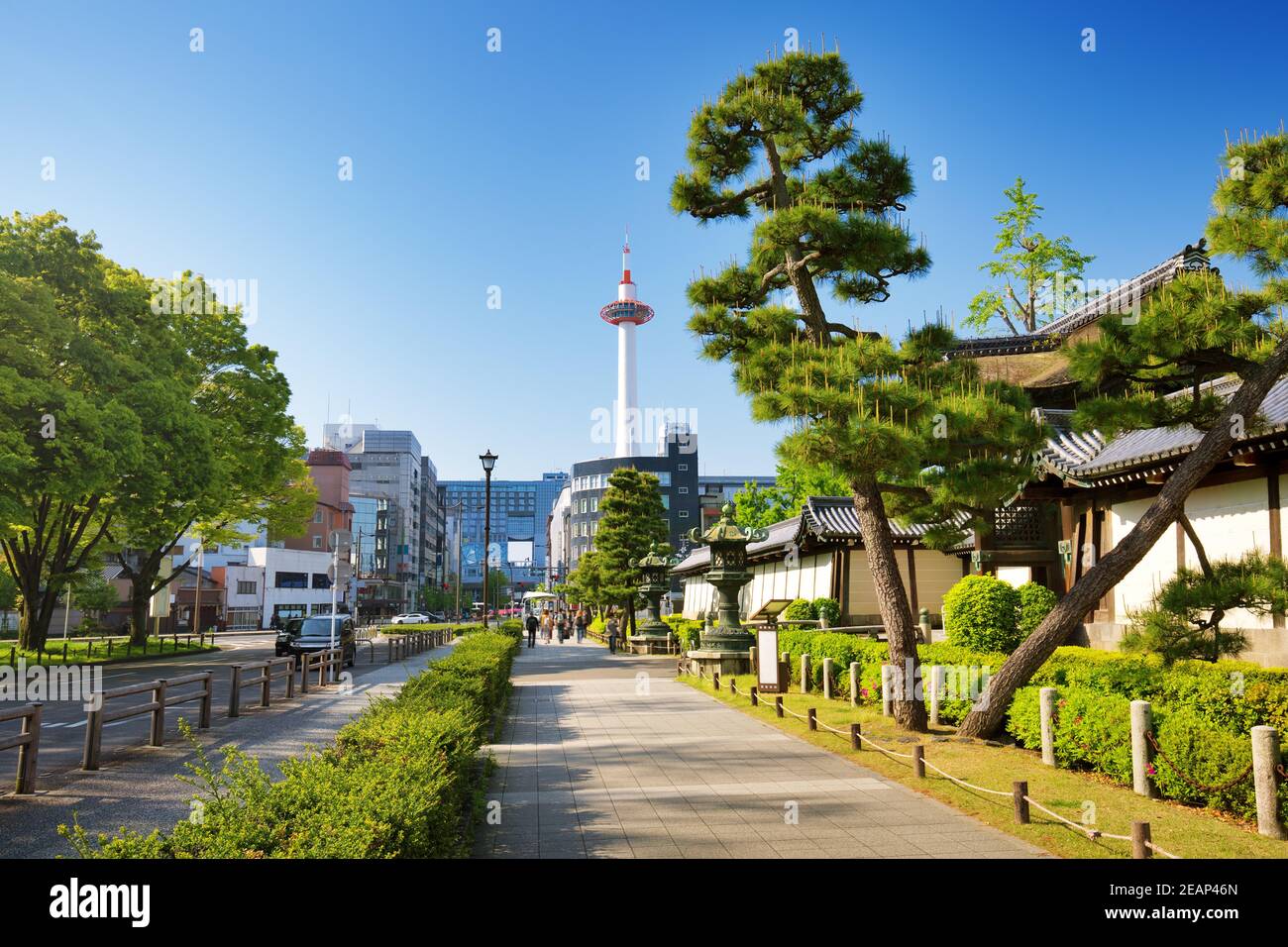 View to Kyoto tower and Kyoto station from a pedestrian way near entrance to Higashi Honganji Temple Stock Photo