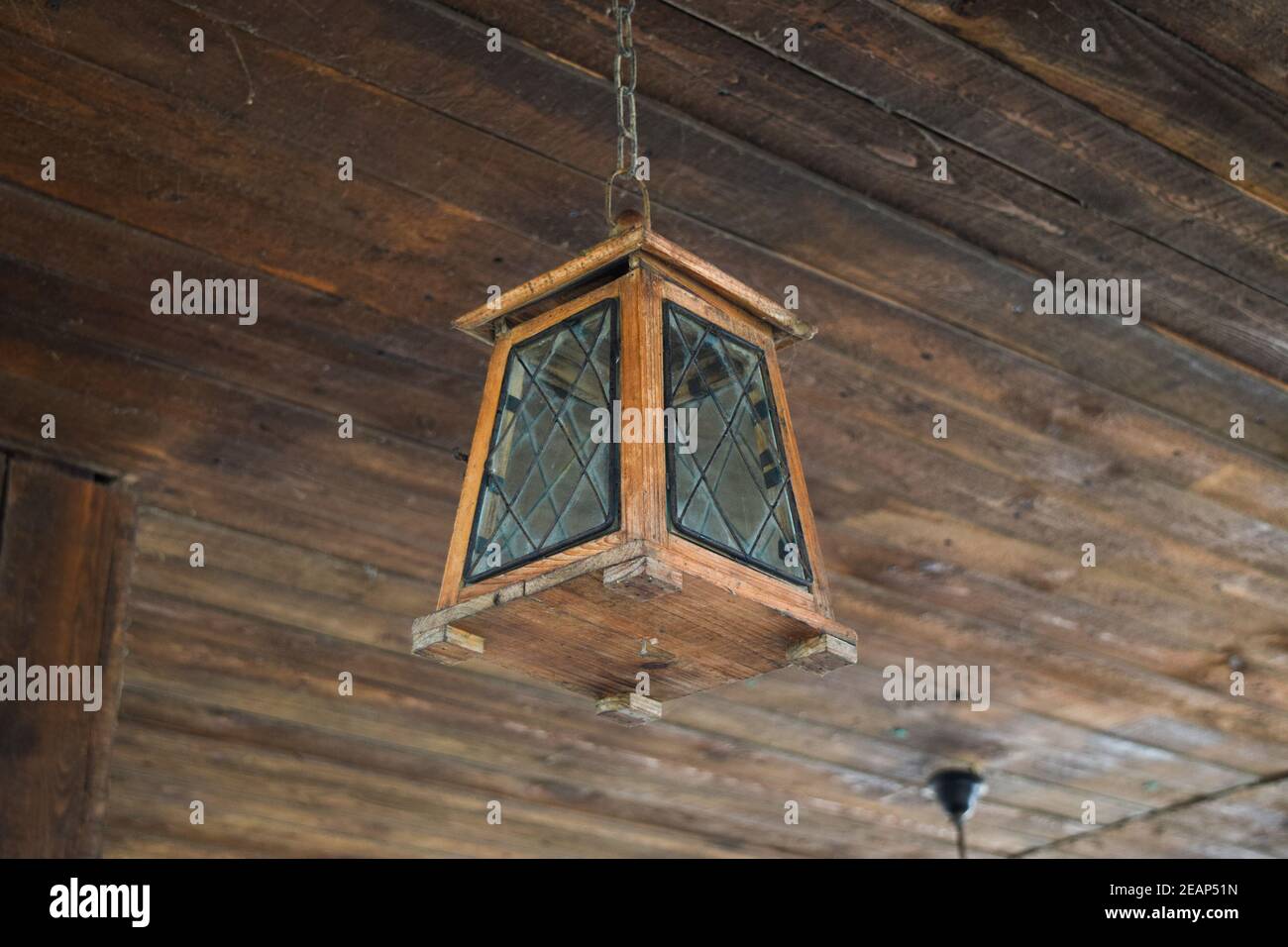 Ceiling lamp on the wooden ceiling Stock Photo