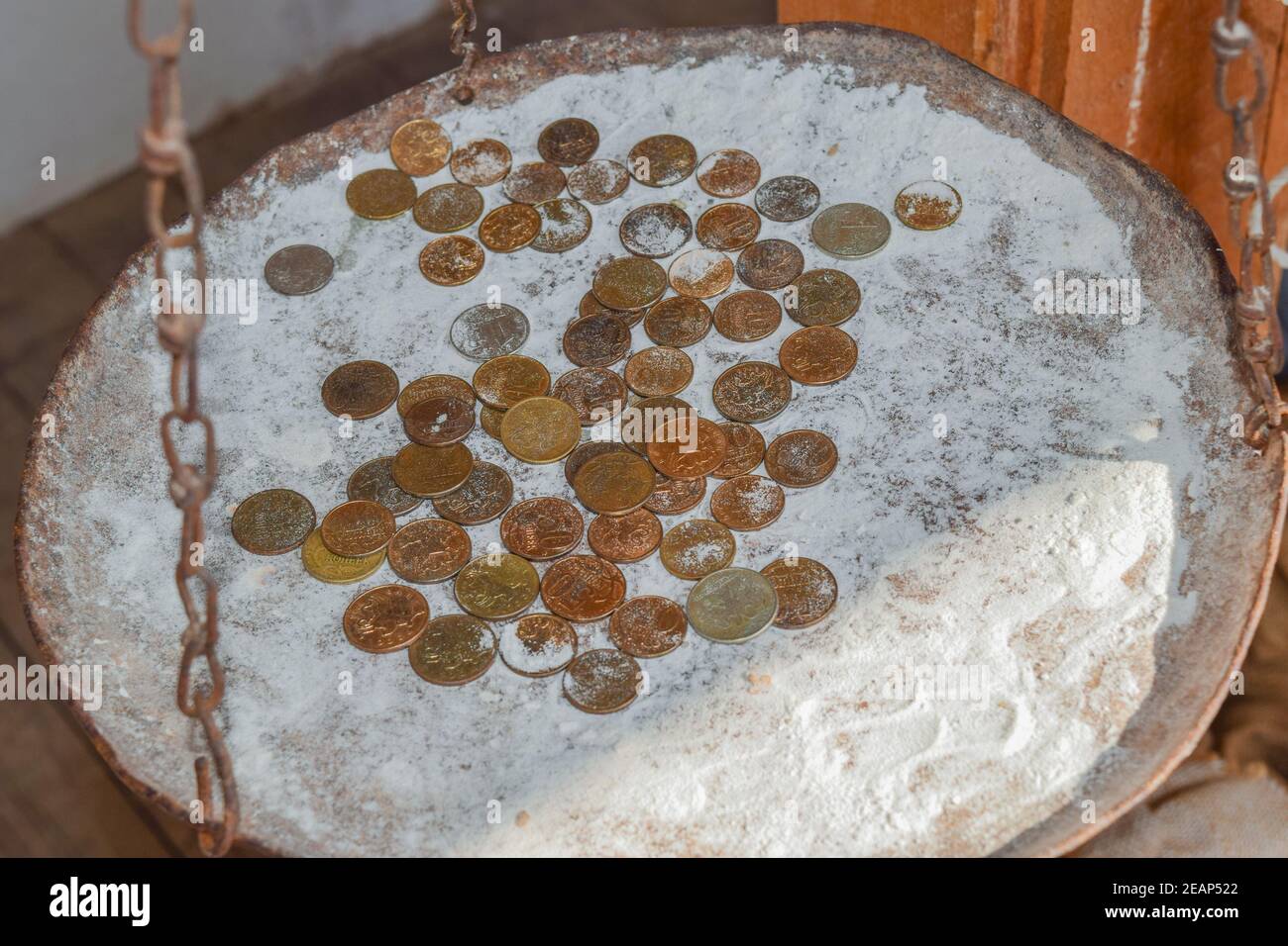 Coins in the flour in the balance. Rubles and kopecks. Stock Photo
