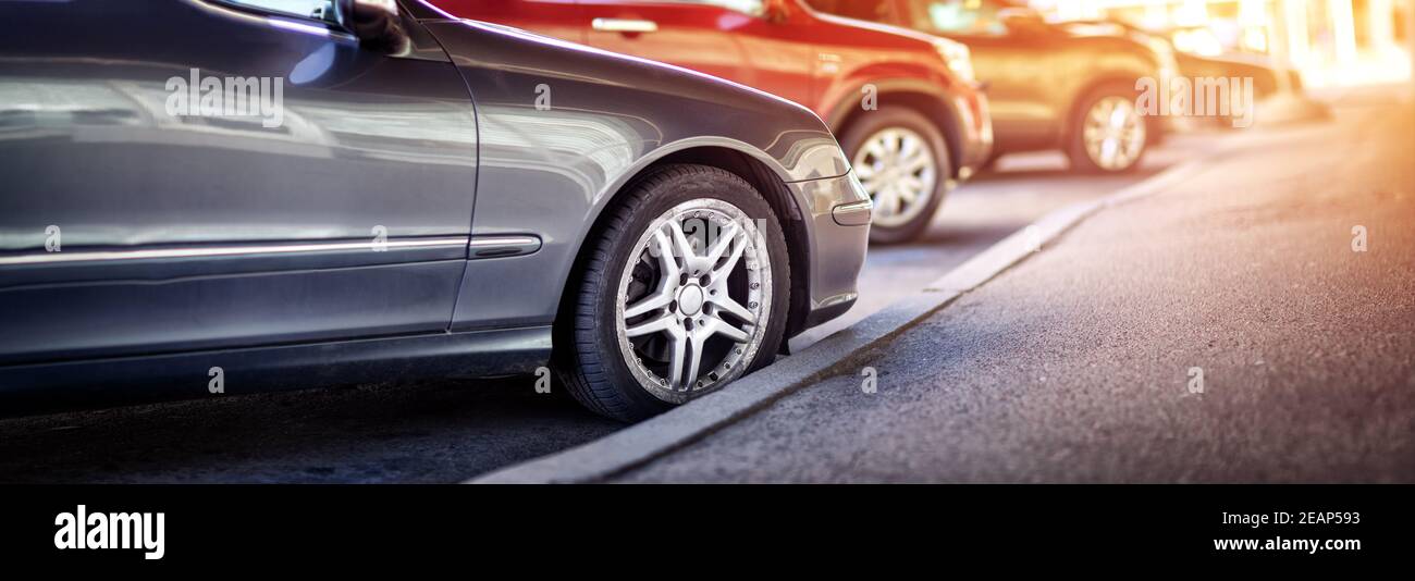 Cars moving on the road in city in early morning Stock Photo