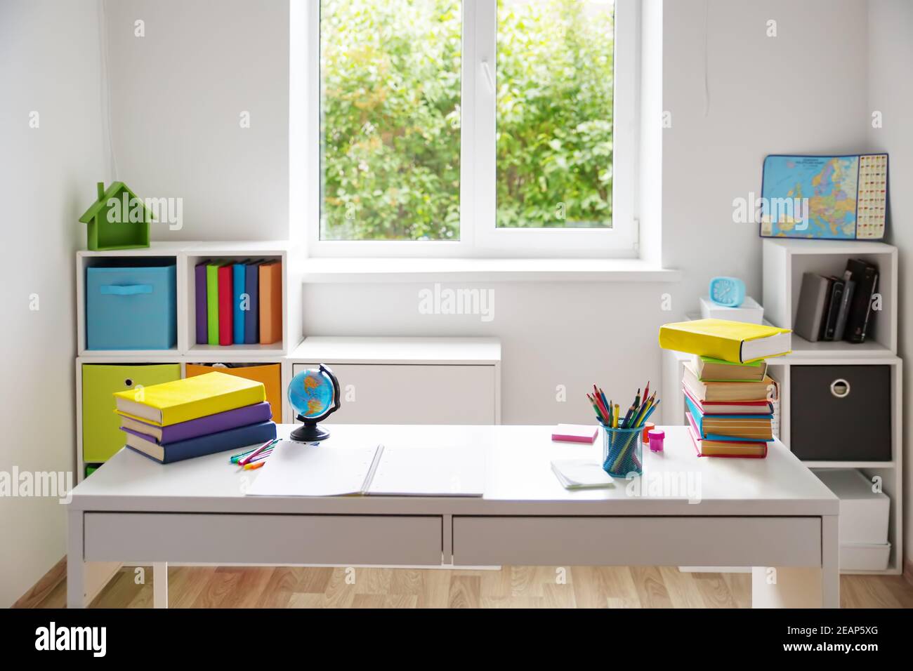 Colourful children rooom with white walls and furniture Stock Photo