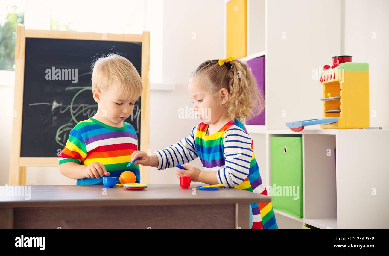 Little child playing with toys in kindergarten Stock Photo - Alamy