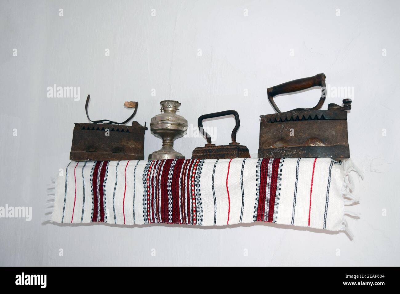 Ancient irons on a timber floor Stock Photo