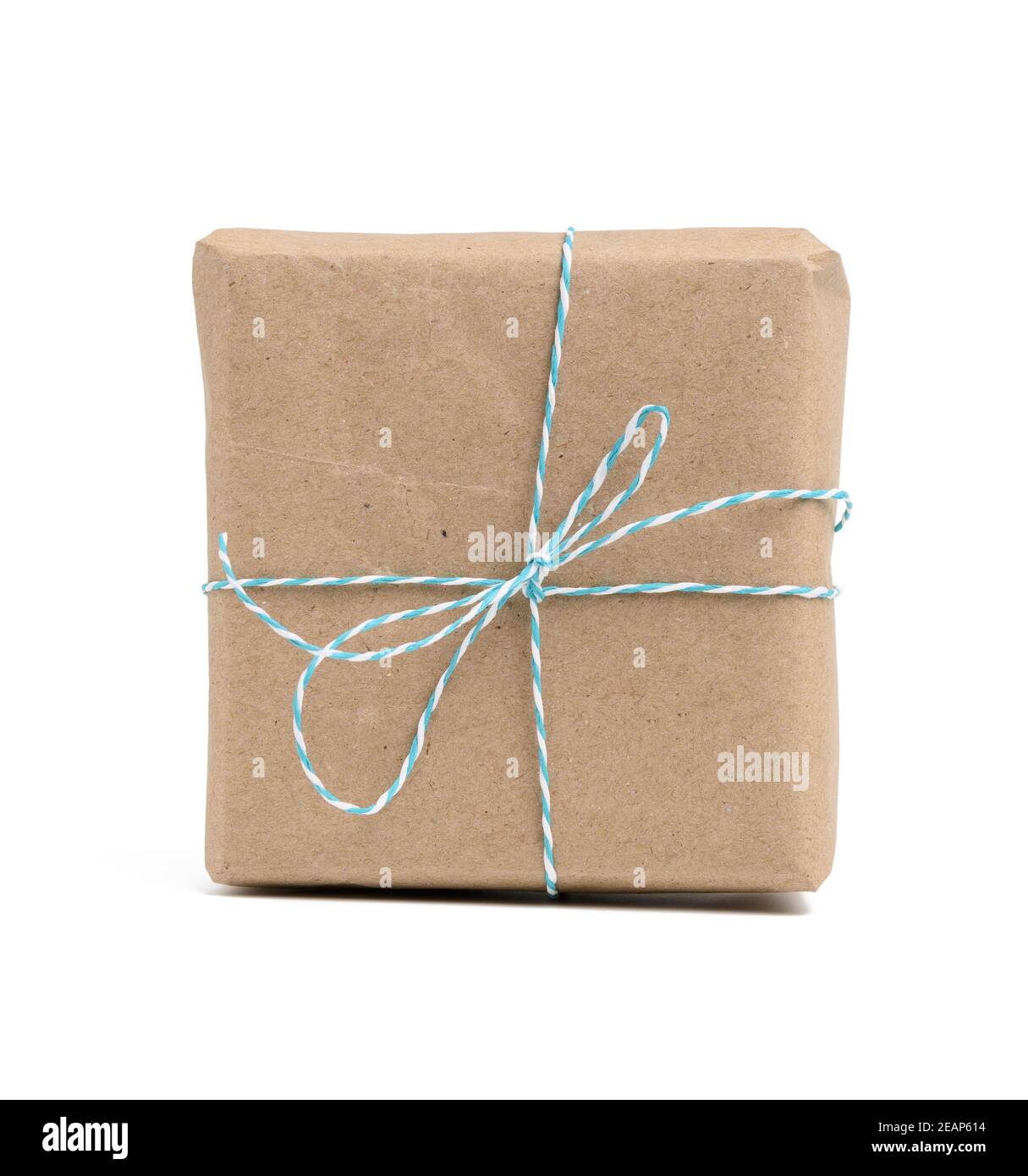 square box wrapped in brown kraft paper and tied with rope Stock Photo