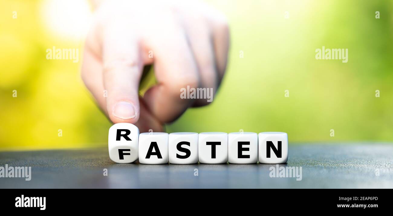Dice form the German words 'rasten' (relax) and 'fasten' (fasting). Stock Photo