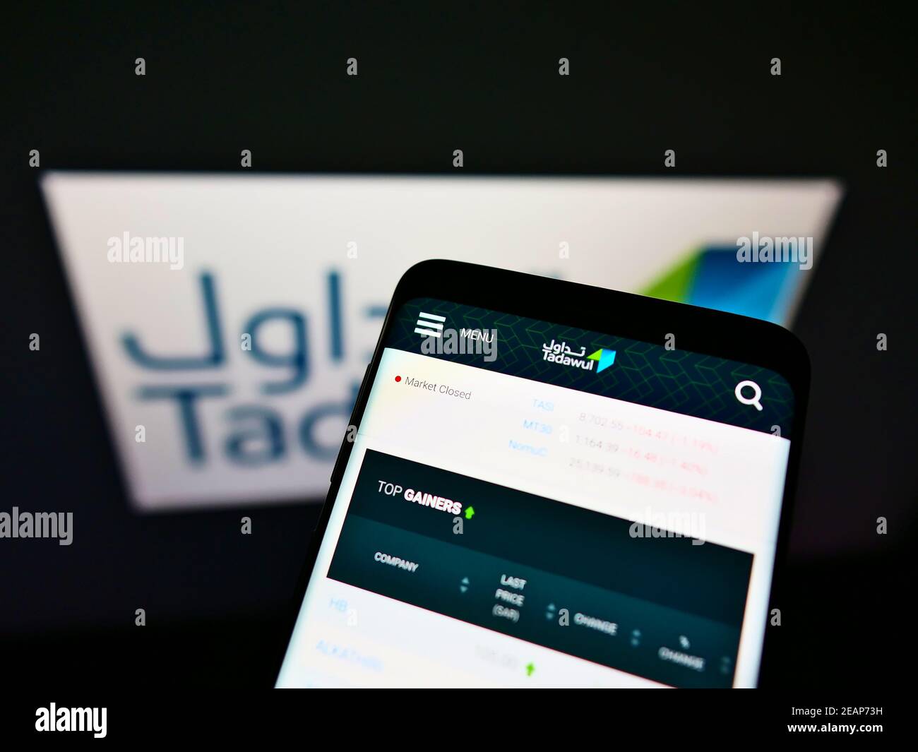 Mobile phone with business web page of Saudi Arabian stock exchange