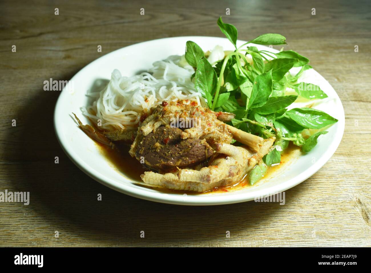 rice noodles dressing with chicken foot and blood curry sauce with