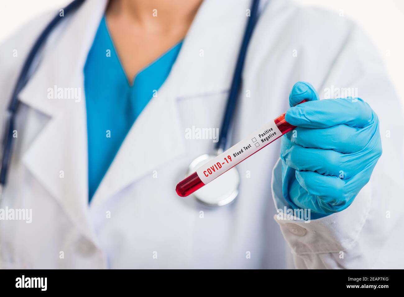 Doctor scientist in white uniform wear a mask holding test tube Coronavirus Stock Photo