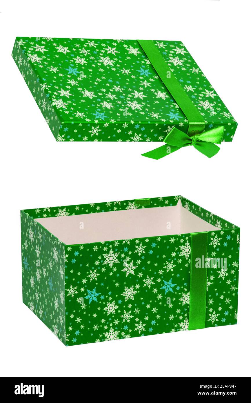 Gift box isolated. Close-up of a green present or gift box with ribbon bow isolated on a white background. Birthday, valentine, anniversary or other holidays. Macro photograph. Stock Photo