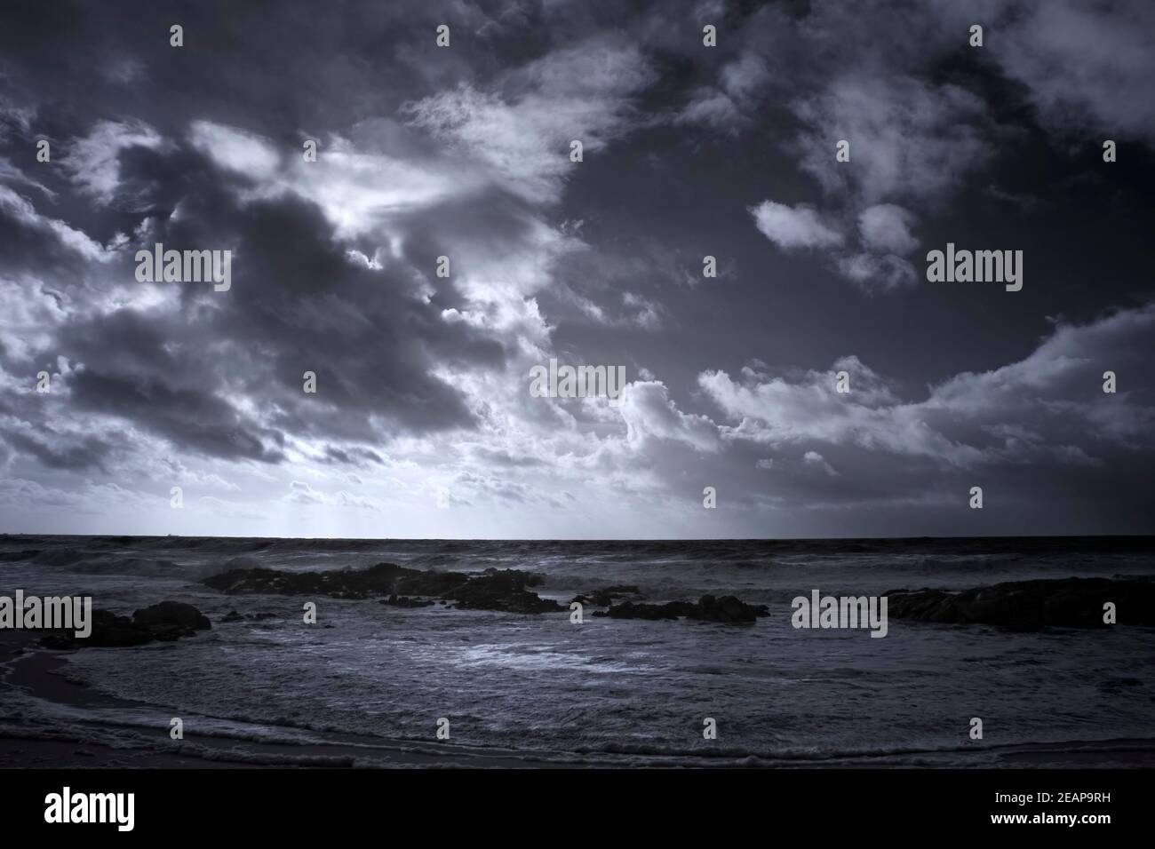 Infrared seascape with a dramatic cloudy sky Stock Photo - Alamy