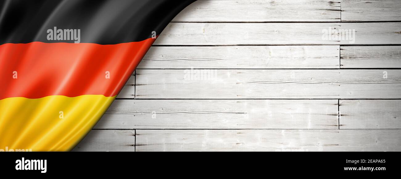 German flag on old white wall banner Stock Photo