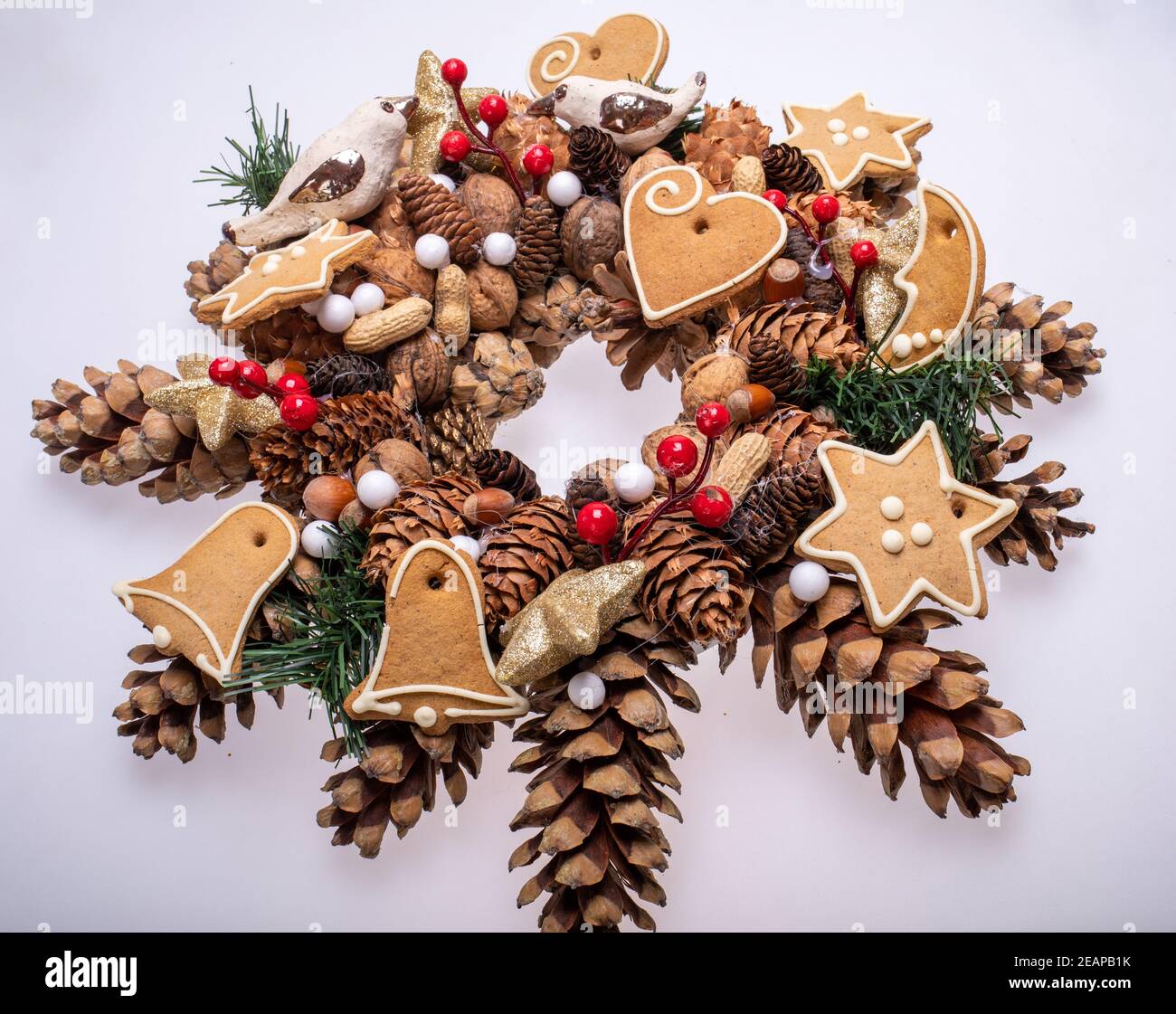 Christmas decorations with pine cones, nuts and handmade Christmas cookies Stock Photo