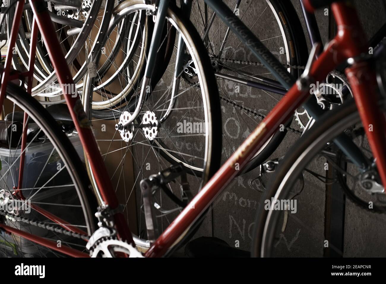 vintage bicyles on garage wall Stock Photo