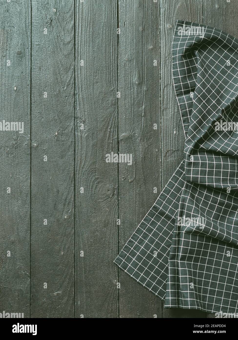Gray wooden table with kitchen napkin, flat lay Stock Photo