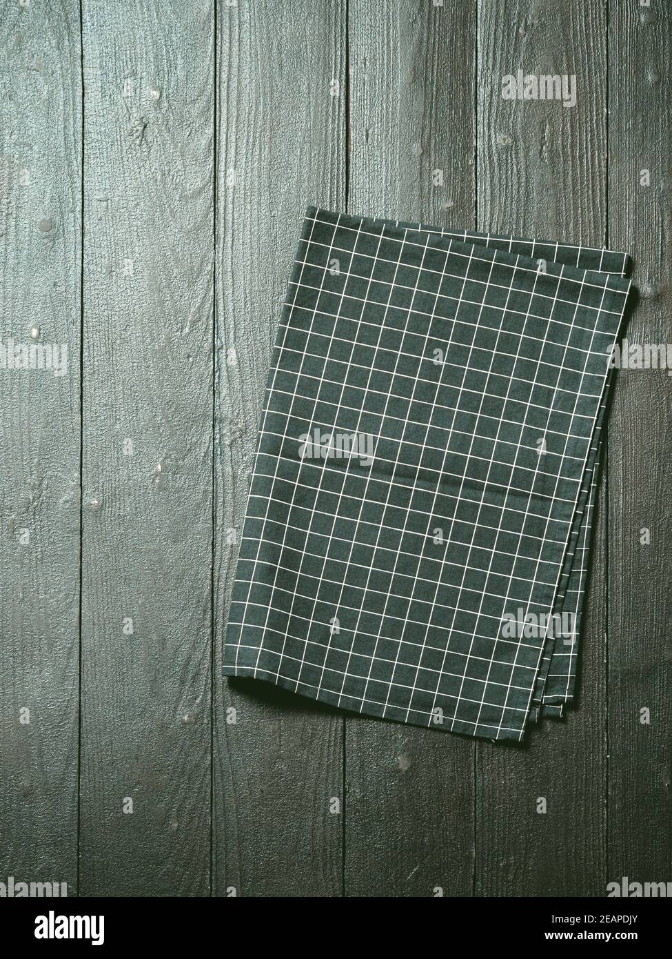 Gray wooden table with kitchen napkin, flat lay Stock Photo