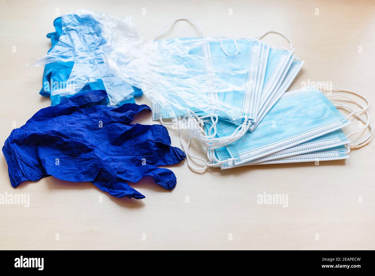 blue disposable protective face masks and gloves Stock Photo