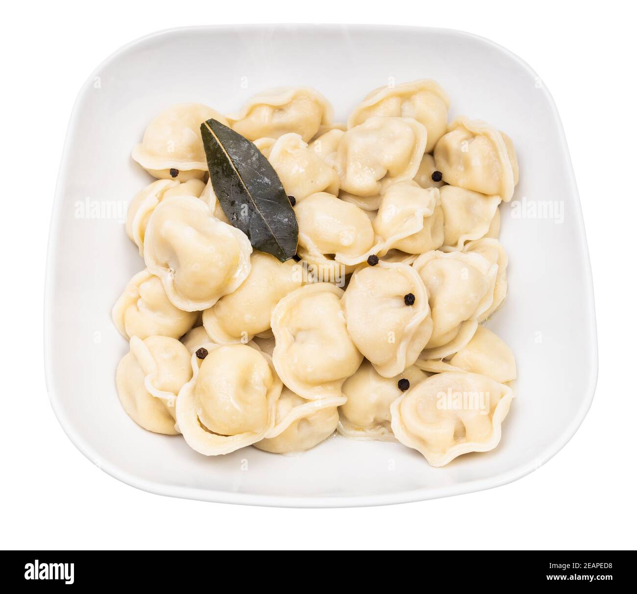 cooked Pelmeni in gray bowl isolated on white Stock Photo