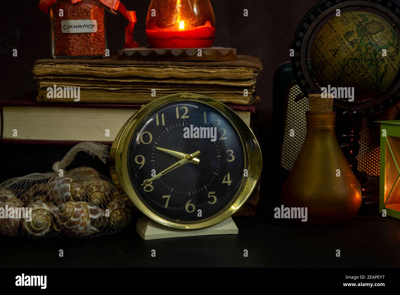 Vintage study table view with books and golden clock in front Stock ...