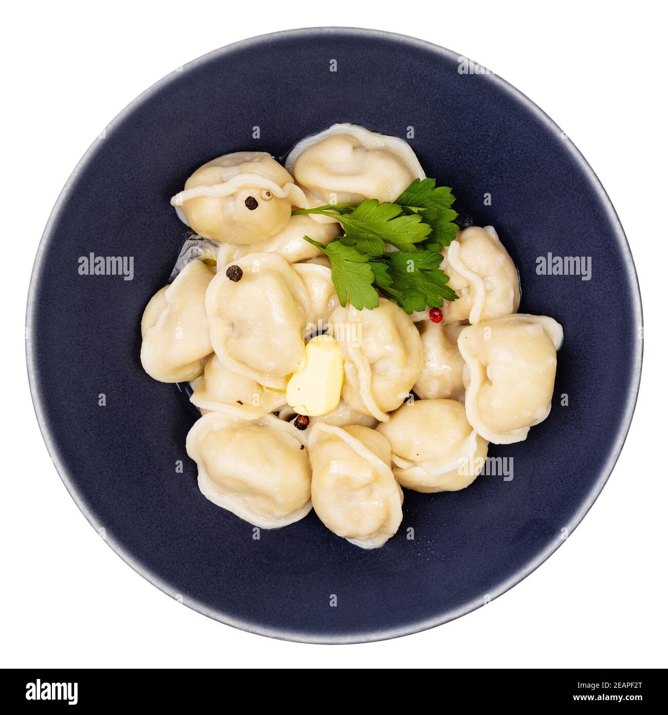 top view of boiled Pelmeni decorated with parsley Stock Photo