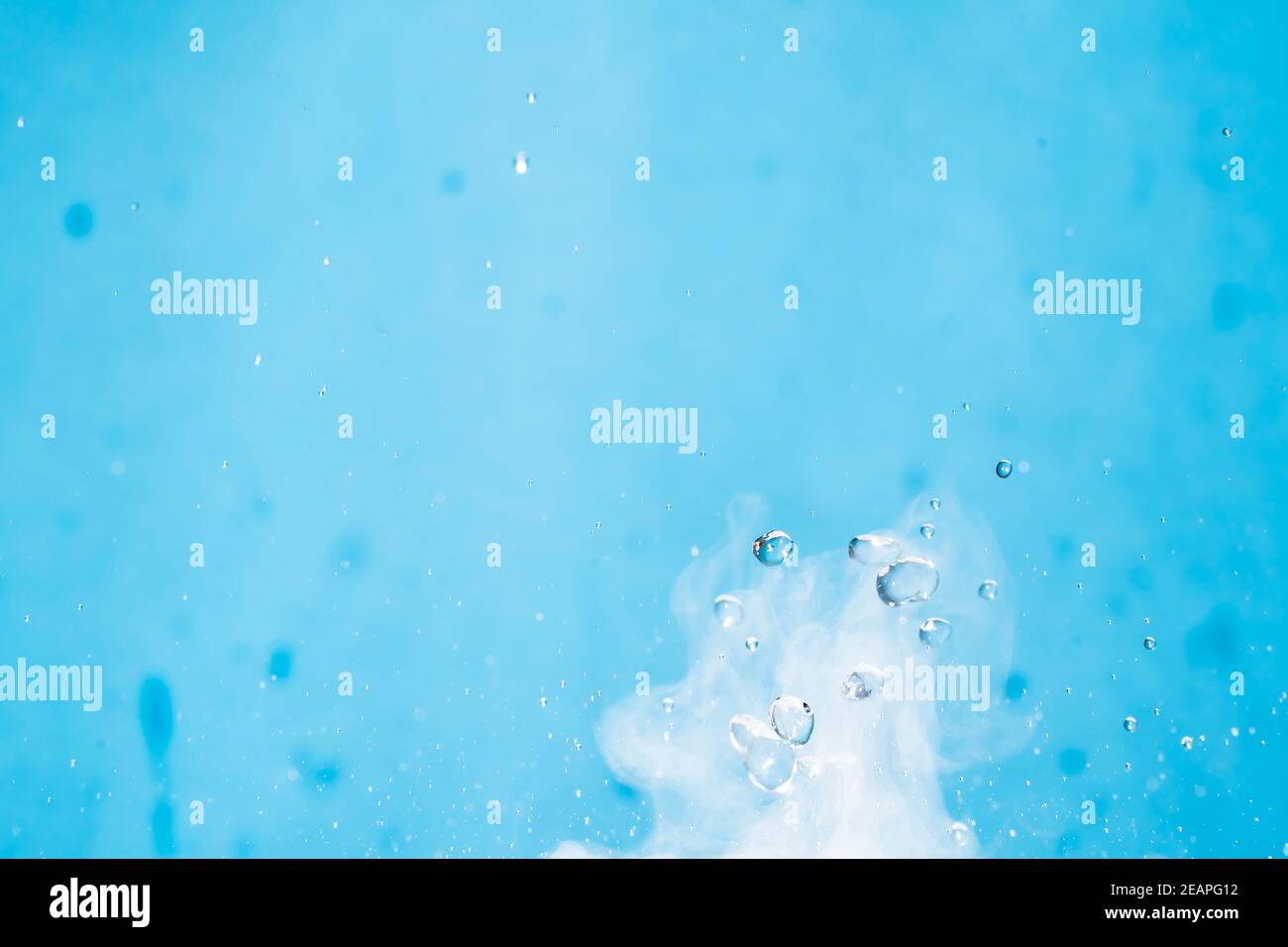 Water drop. Chemical reaction with boiling swirling water splashes