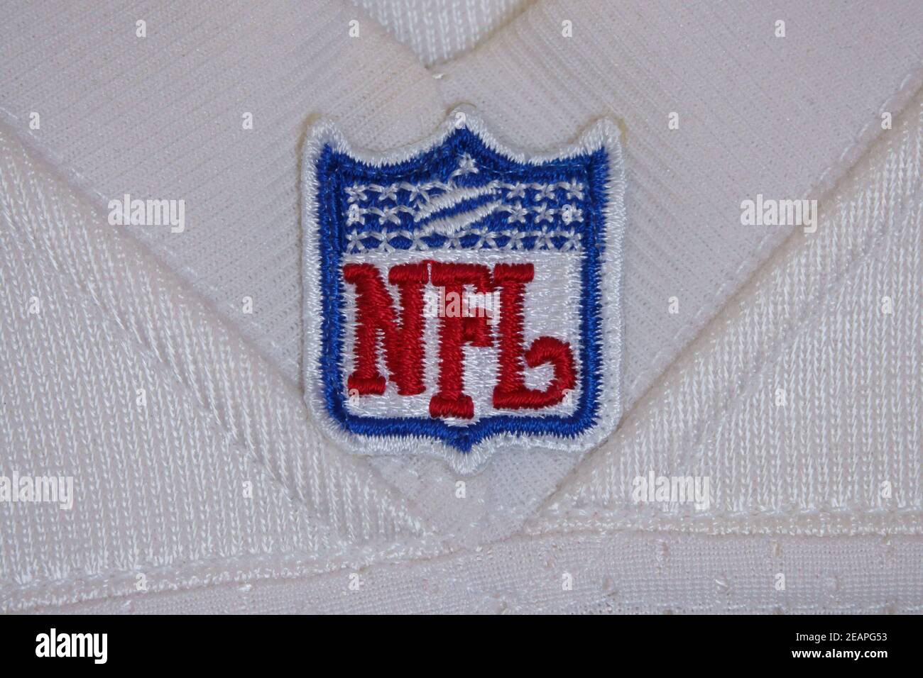 USA / Jan. 4, 2021: A National Football League NFL shield logo patch is shown sewn on an official, white jersey. For editorial uses only. Stock Photo