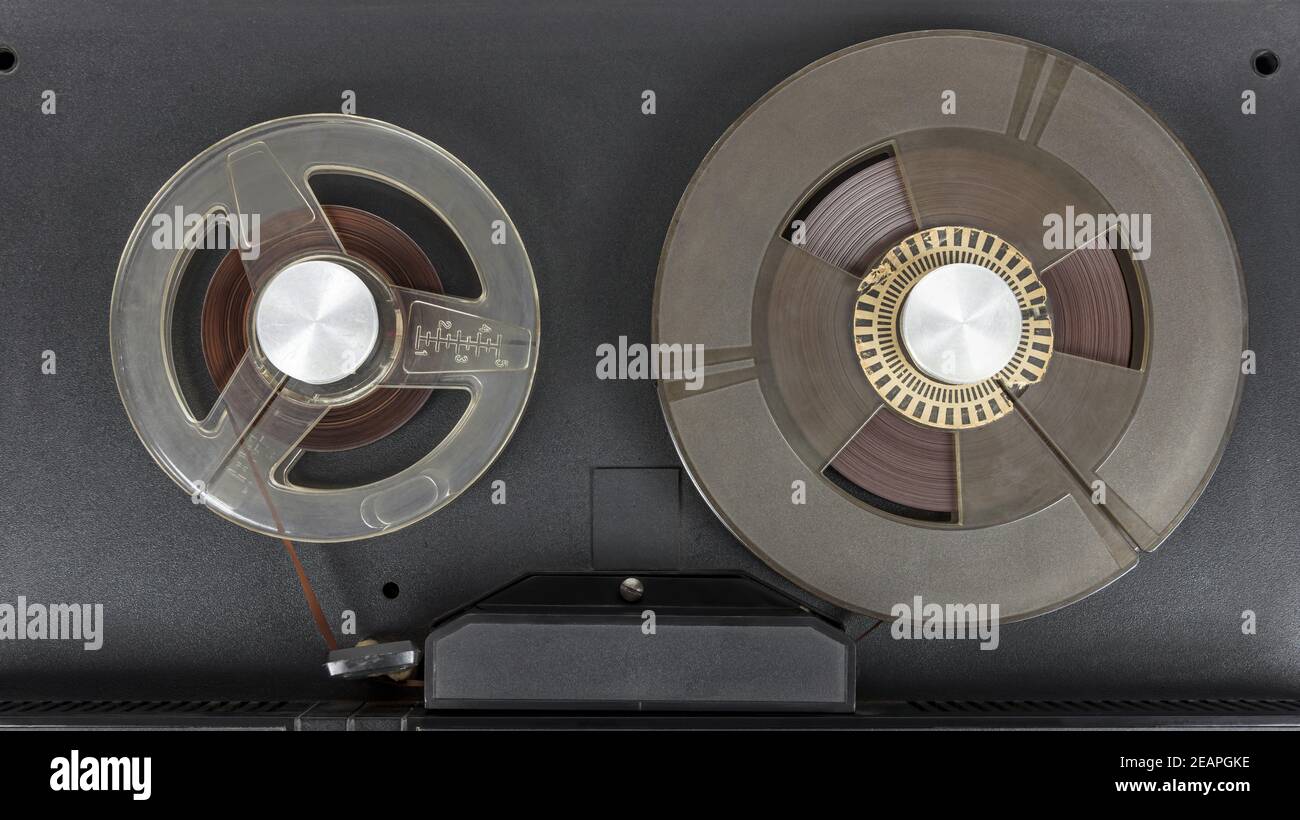 Old audio reel recorder with roll of tape and microphone Stock Photo - Alamy