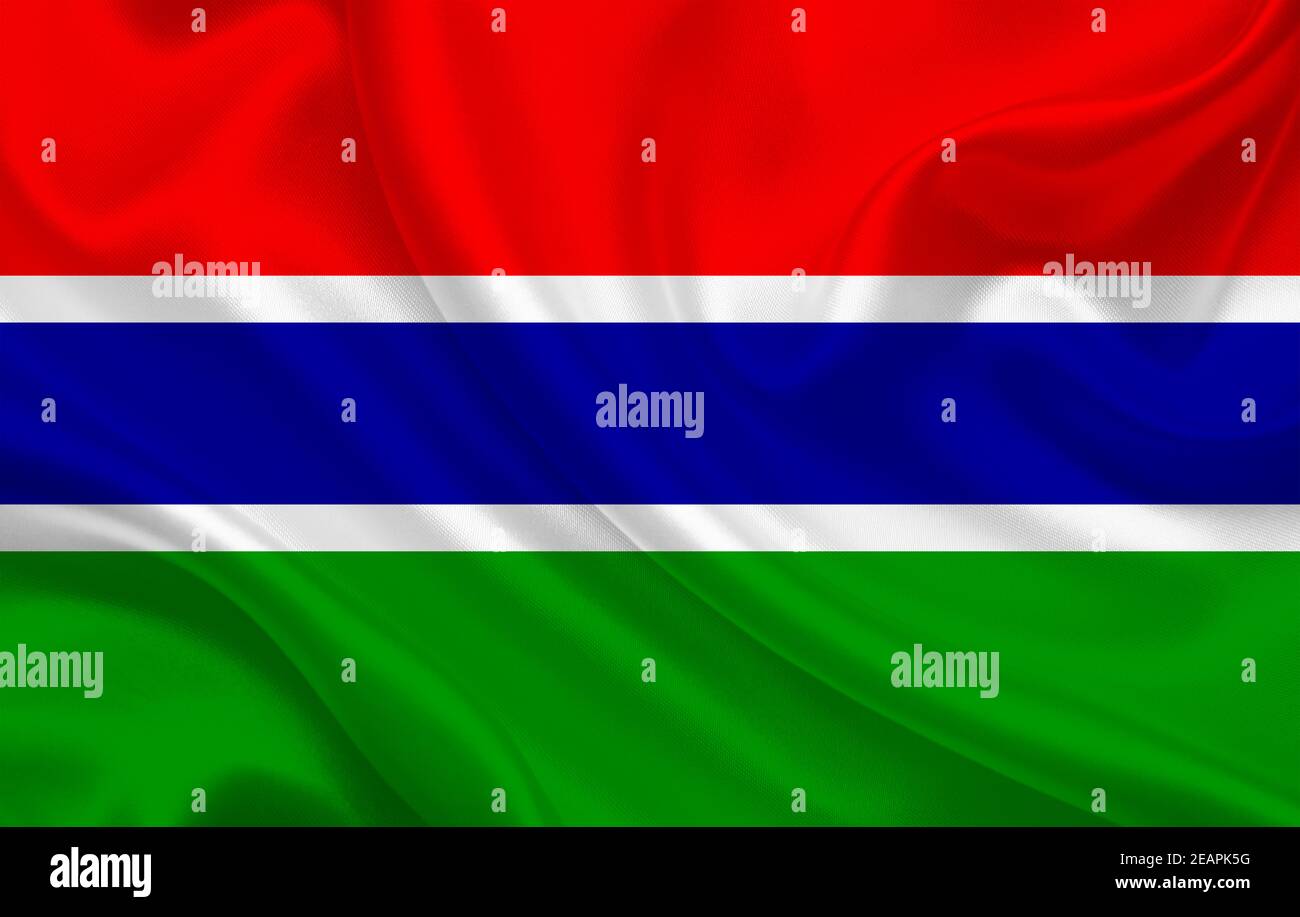 Gambia country flag on wavy silk fabric background panorama Stock Photo