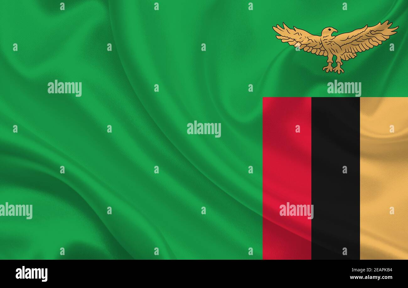 Zambia country flag on wavy silk fabric background panorama Stock Photo