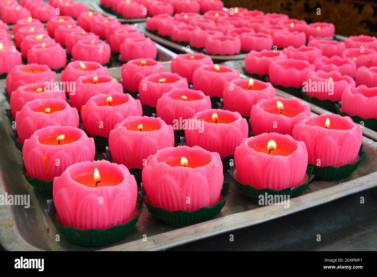 pink candles burning at the Goddess of Mercy Temple in Kuala Lumpur Stock Photo