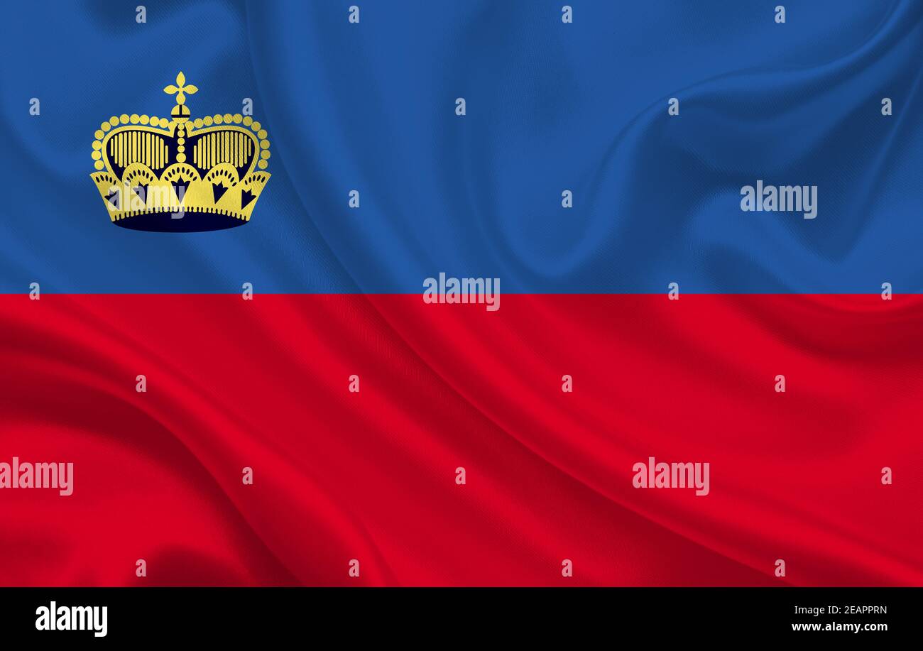 Liechtenstein country flag on wavy silk fabric background panorama Stock Photo