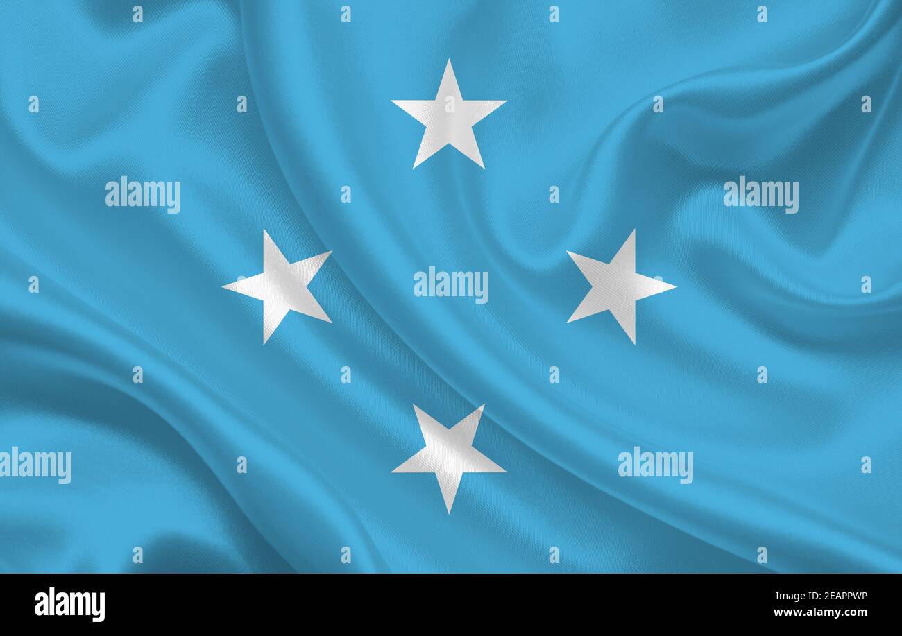 Micronesia country flag on wavy silk fabric background panorama Stock Photo