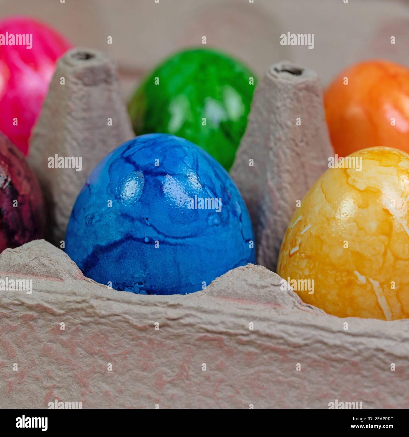 Colored chicken eggs in the package Stock Photo