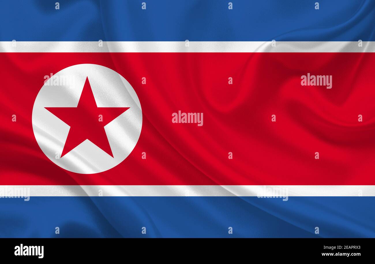 DPRK country flag on wavy silk fabric background panorama Stock Photo