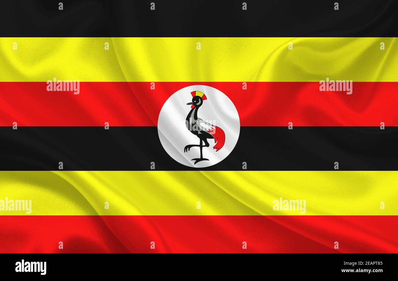 Uganda country flag on wavy silk fabric background panorama Stock Photo