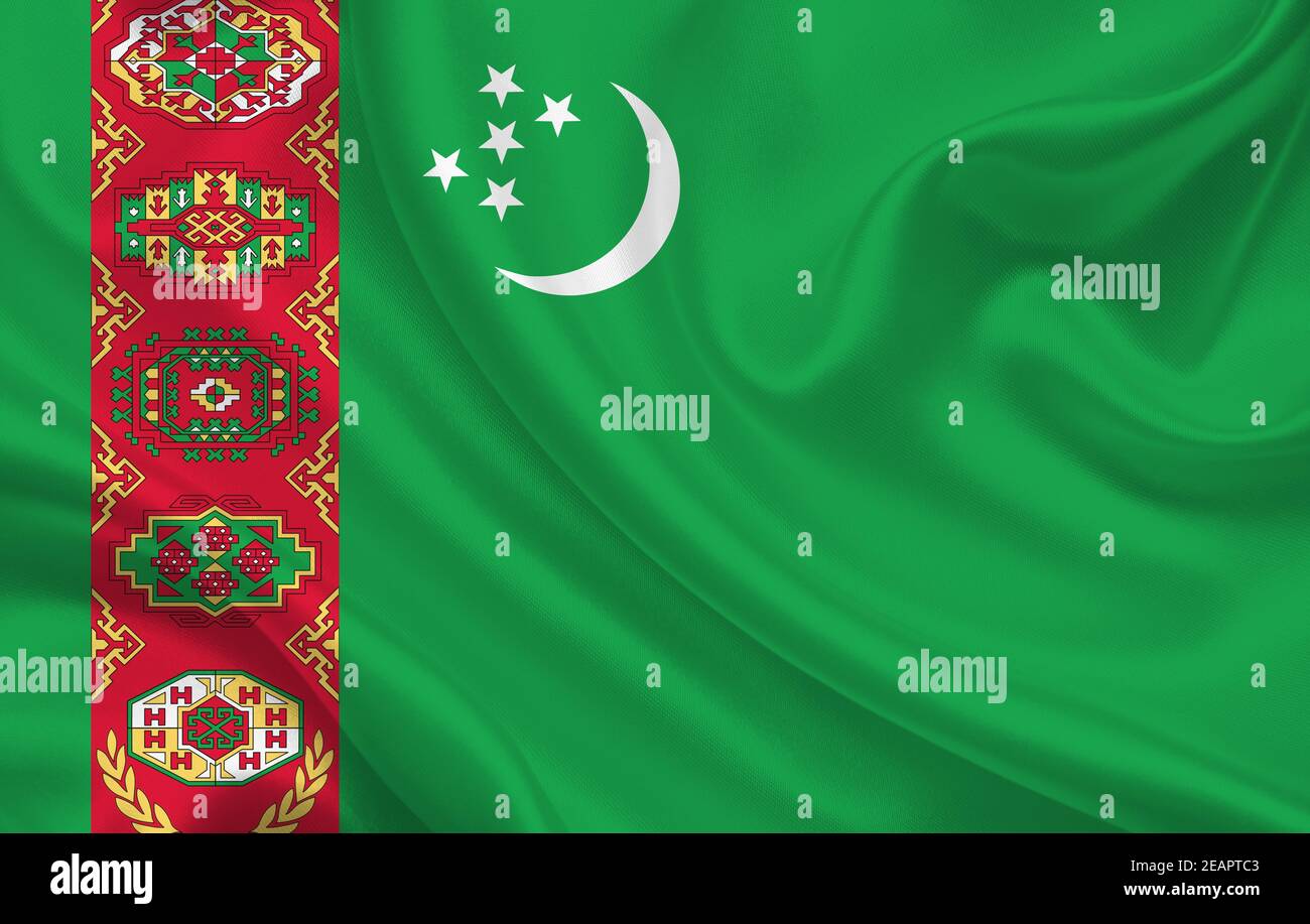 Turkmenistan country flag on wavy silk fabric background panorama Stock Photo