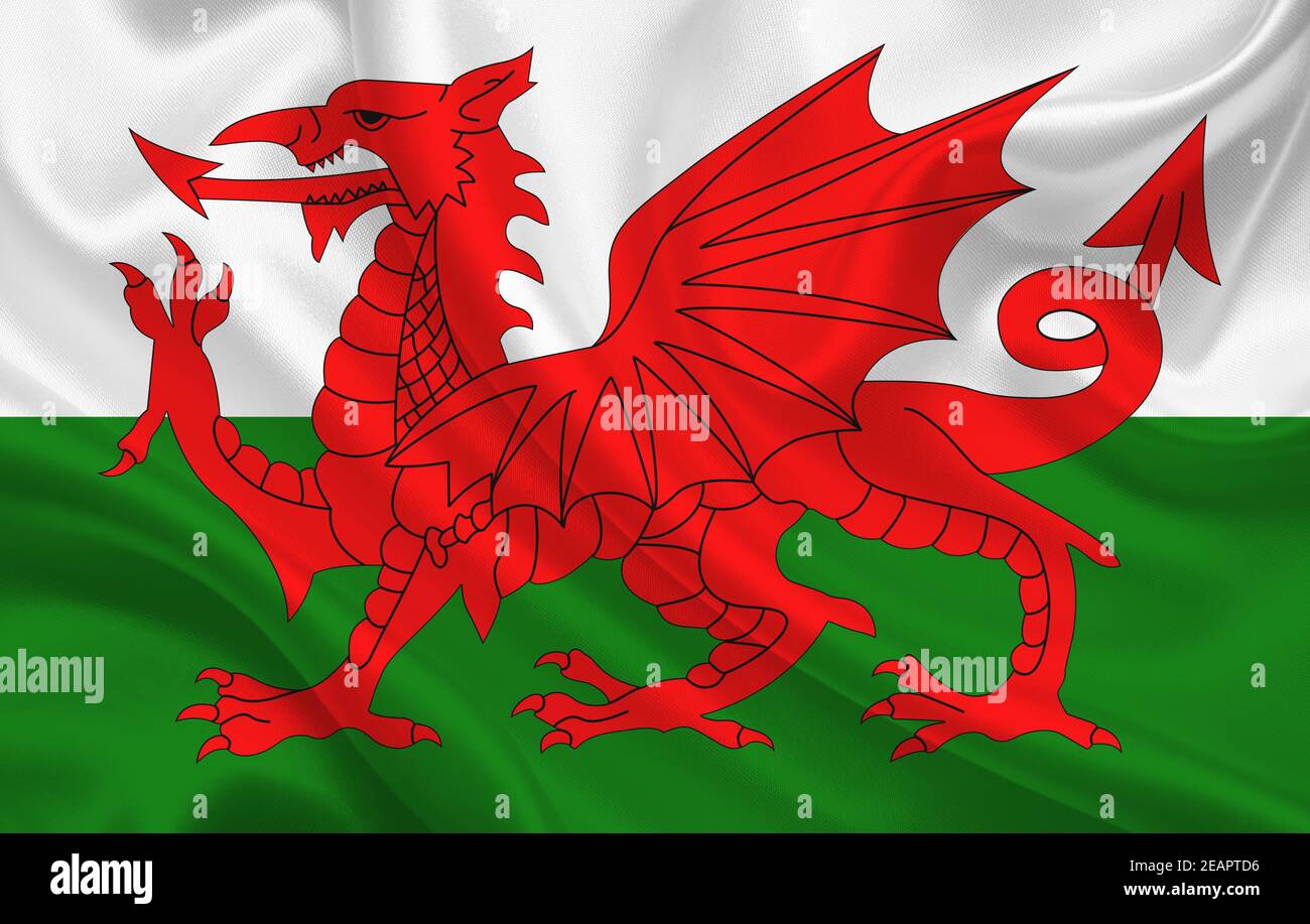 Wales country flag on wavy silk fabric background panorama Stock Photo