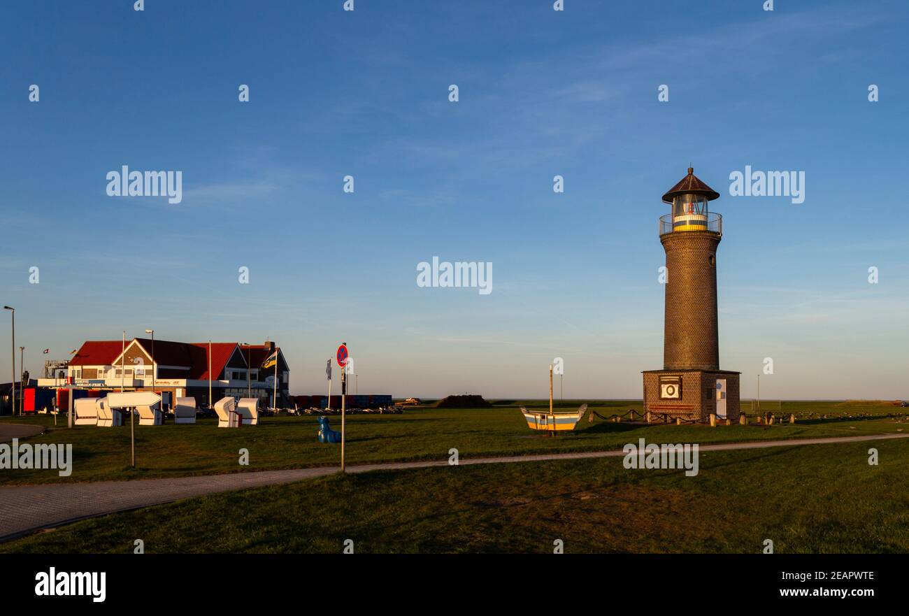The photo shows the Juist lighthouse in the morning sun Stock Photo