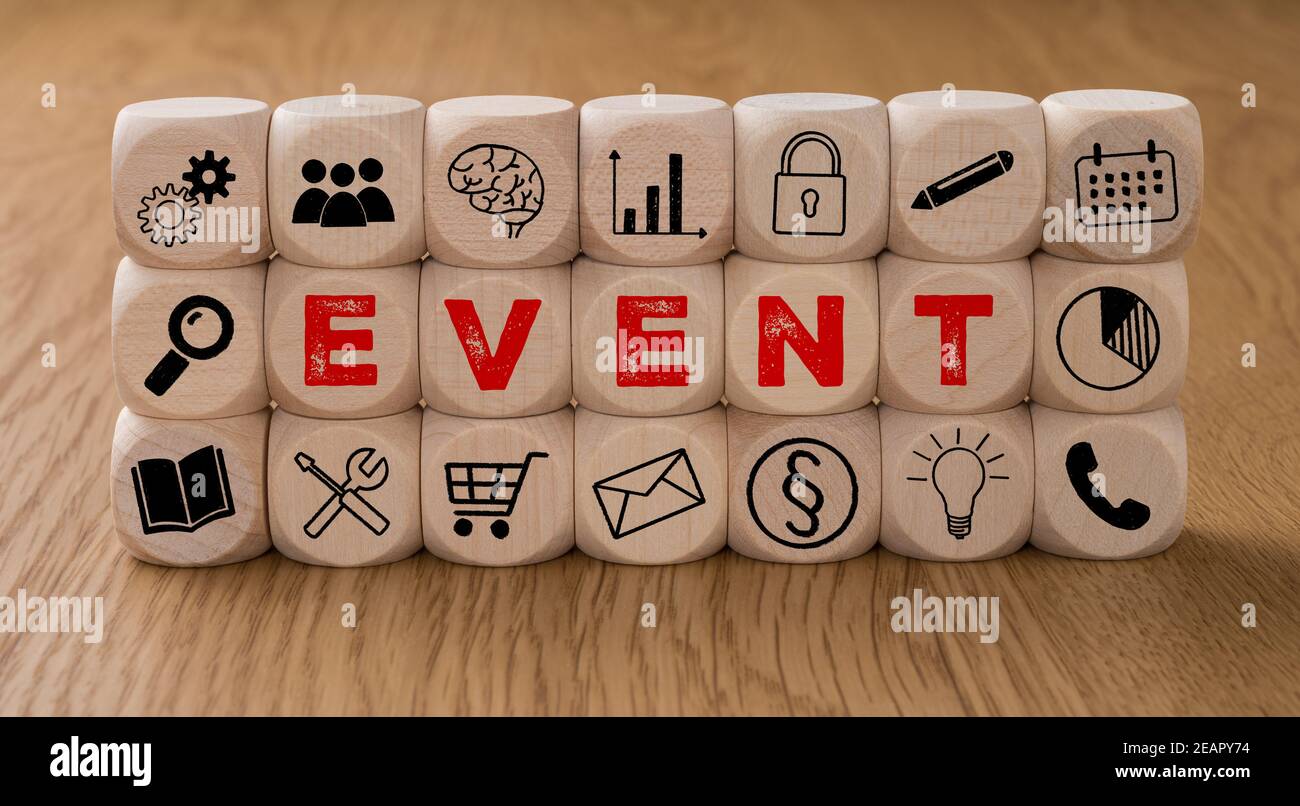 Dice with icons and the word Event Stock Photo Alamy