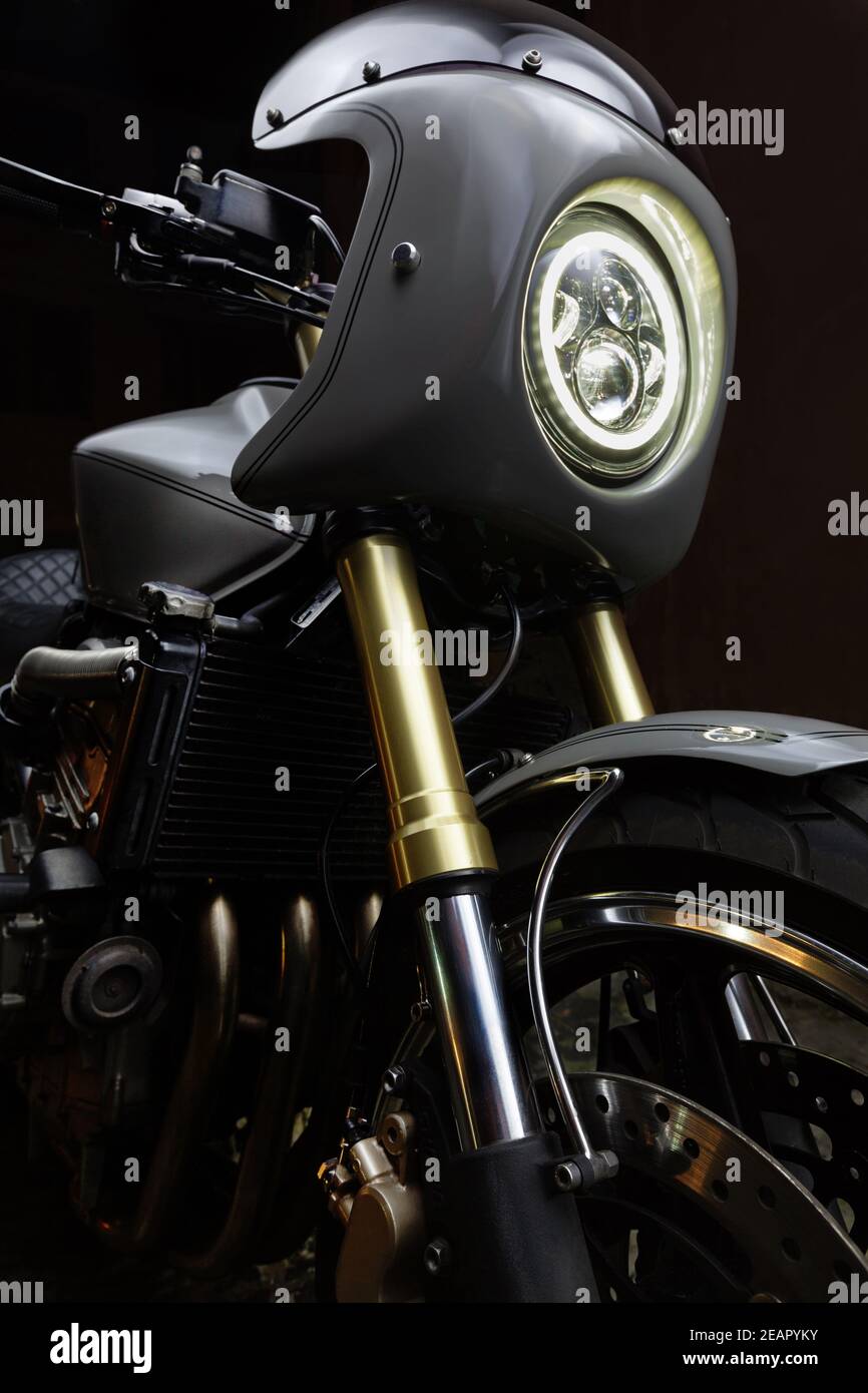 Custom caferacer motorbike on dark background with its headlight on Stock Photo - Alamy Custom caferacer motorbike on dark background with its headlight on Stock Photo - Alamy