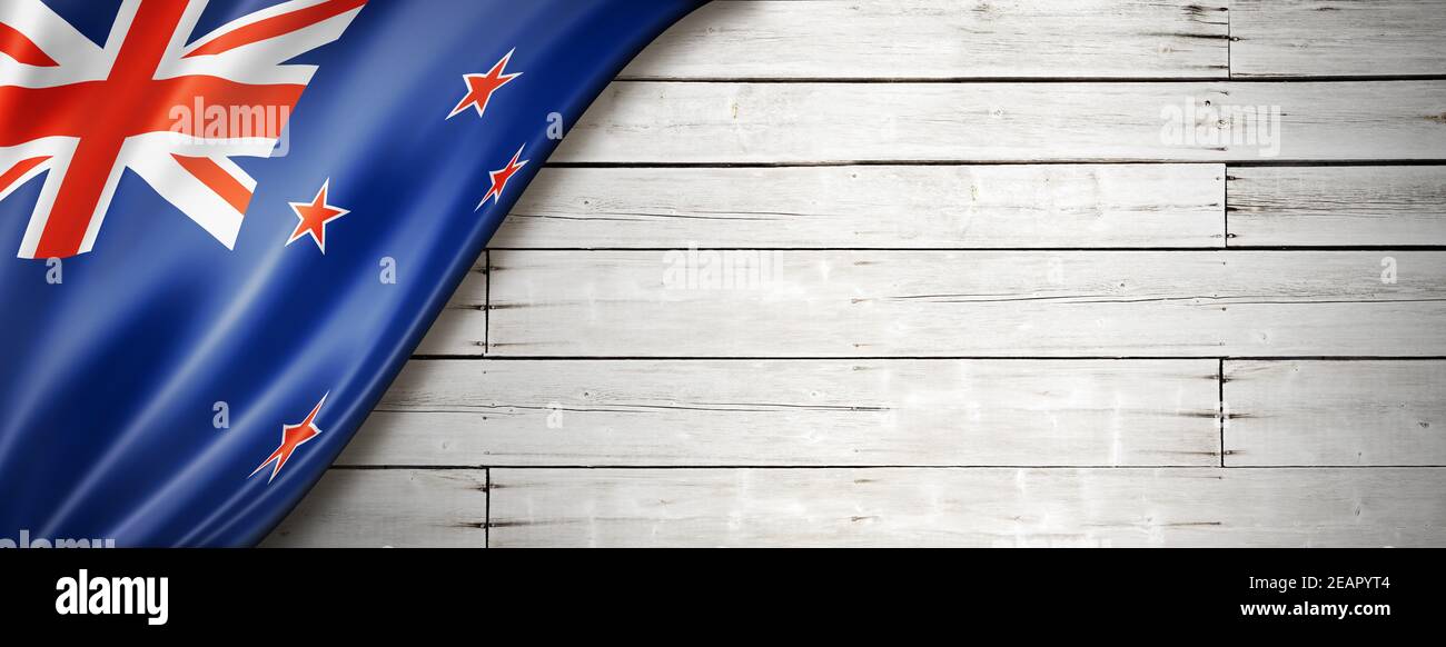 New Zealand flag on old white wall banner Stock Photo