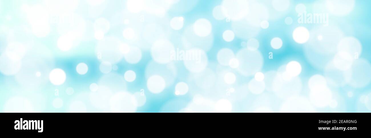 White blurred bokeh on a blue background Stock Photo - Alamy