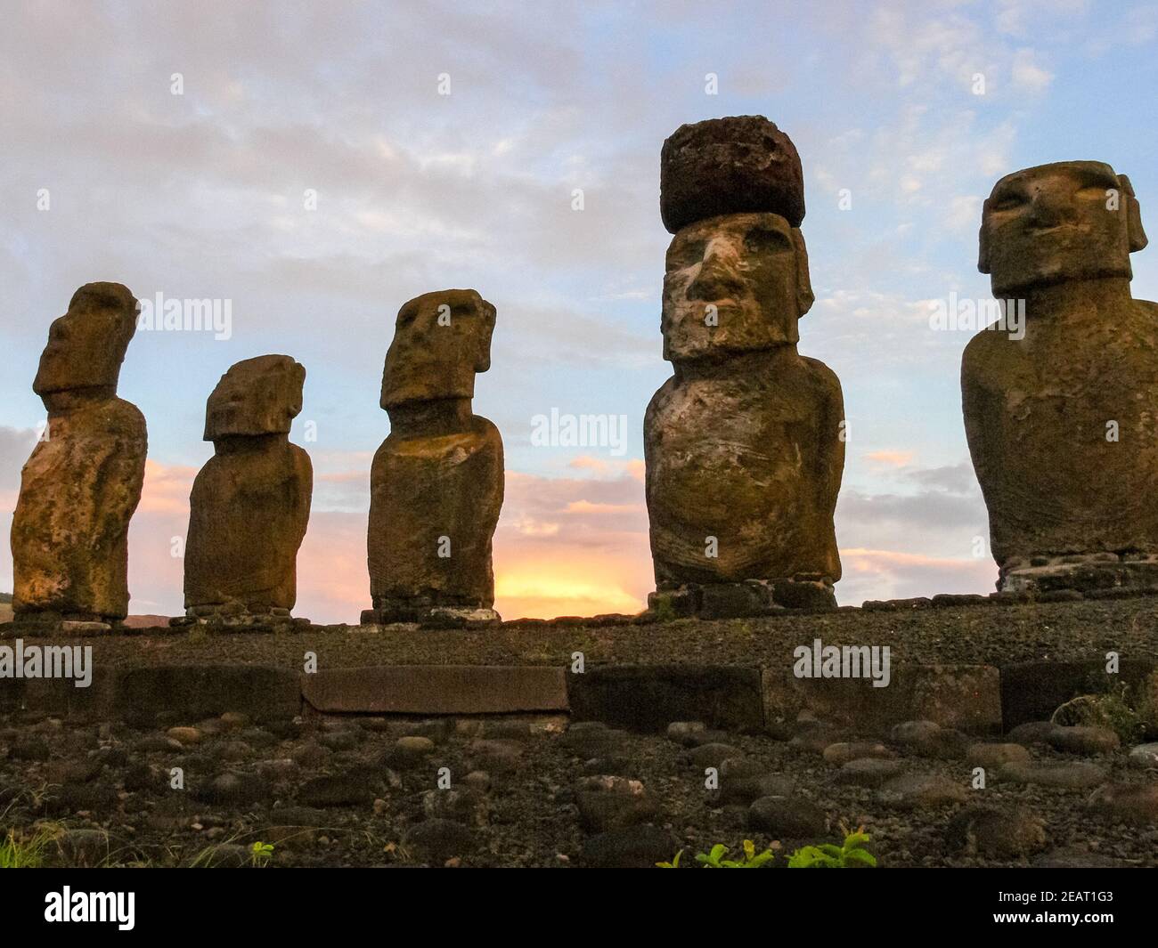 Statues of Easter Island in the background of the sunset. melting of