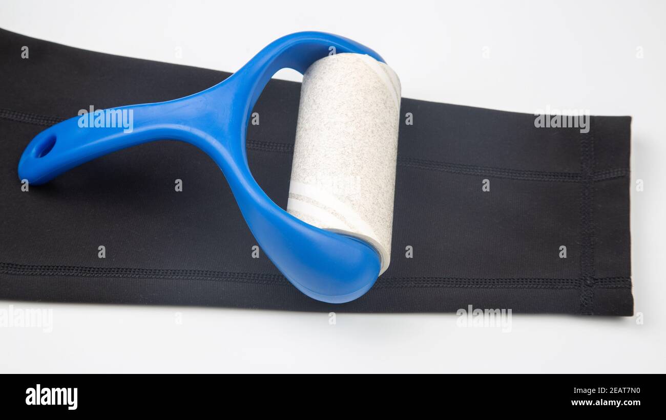 sticky plastic roller for cleaning clothes from dust, lint and hair Stock Photo Alamy