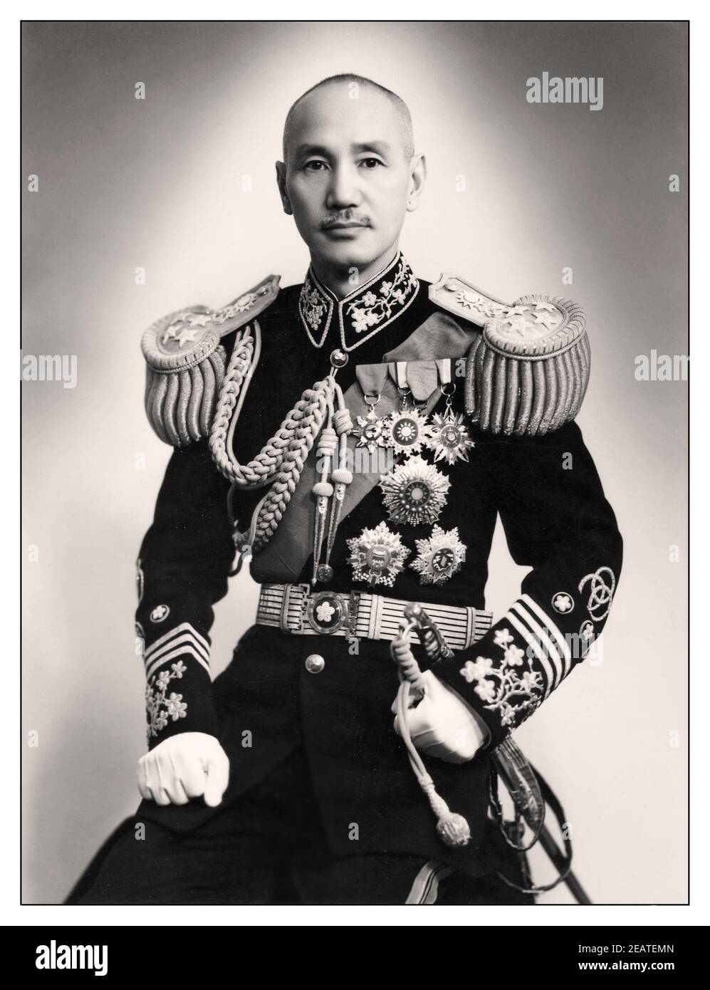 1940's WW2 Chiang Kai-shek Chairman of the National Government of the Republic of China 1943 formal studio portrait of  Chiang Kai-shek in official uniform, leader of Taiwan Chiang Kai-shek (31 October 1887 – 5 April 1975) also known as Chiang Chung-cheng and romanized via Mandarin as Chiang Chieh-shih and Jiang Jieshi, was a Chinese Nationalist politician, revolutionary and military leader who served as the leader of the Republic of China between 1928 and 1975, first in mainland China until 1949 and then in Taiwan until his death. Stock Photo
