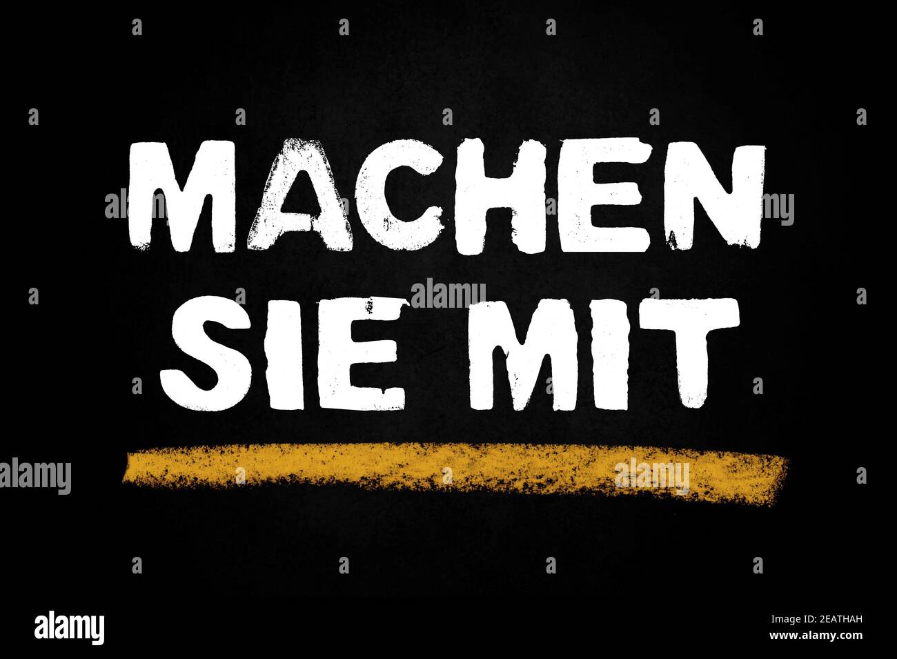 Black chalkboard showing Take part in german language Stock Photo Alamy