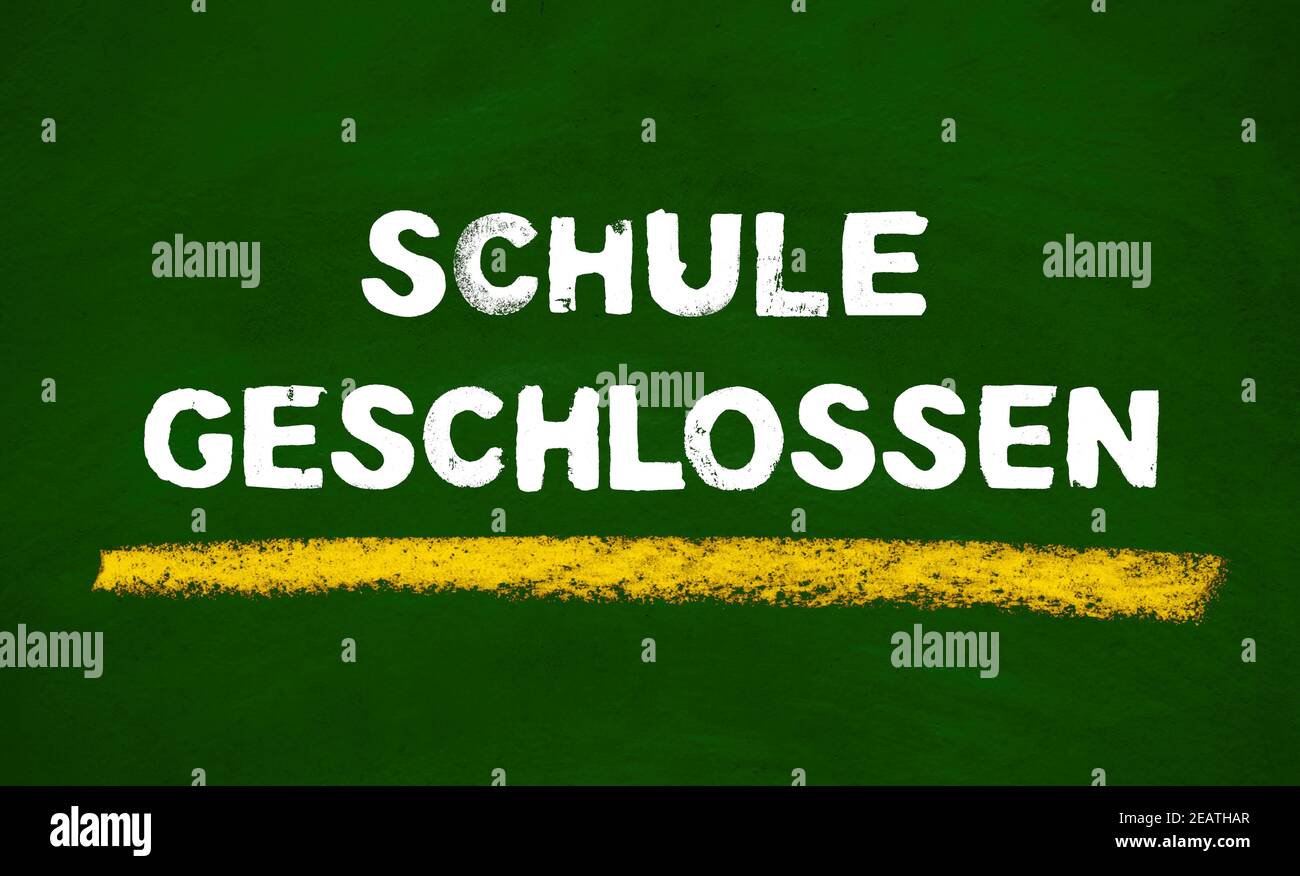 Green chalkboard showing School closed in german language Stock Photo